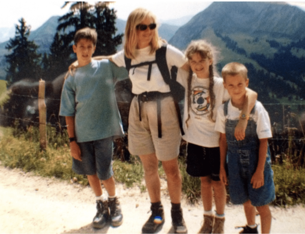 woman on a hike with her three children